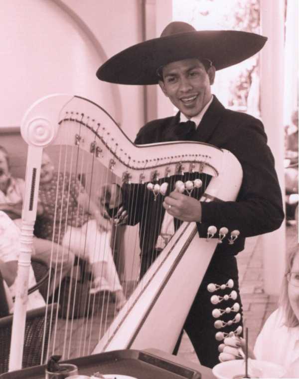 Victor playing the harp
