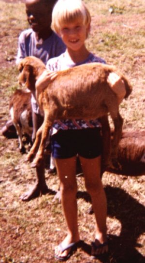 Holding baby goat